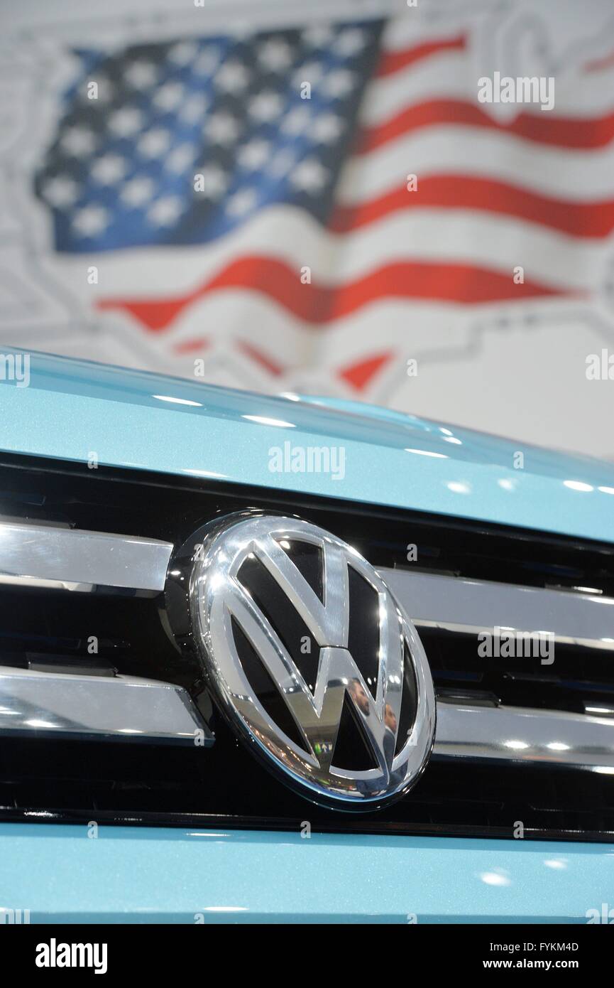 A car from Volkswagen stands in front of a flag of the United States of America, Germany, city of Hannover, 25. April 2016. Photo: Frank May Stock Photo