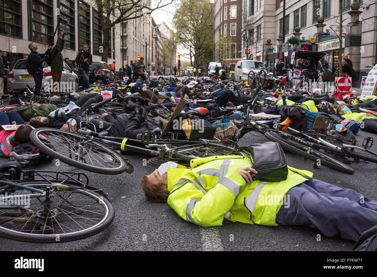 London UK 27th April 2016. Cyclists protest outside the Department of Transport on Horseferry Road in London. They were calling for better cycling infrastructure and stringent measures to bring down traffic pollution Credit: Patricia Phillips/Alamy Live News Stock Photo