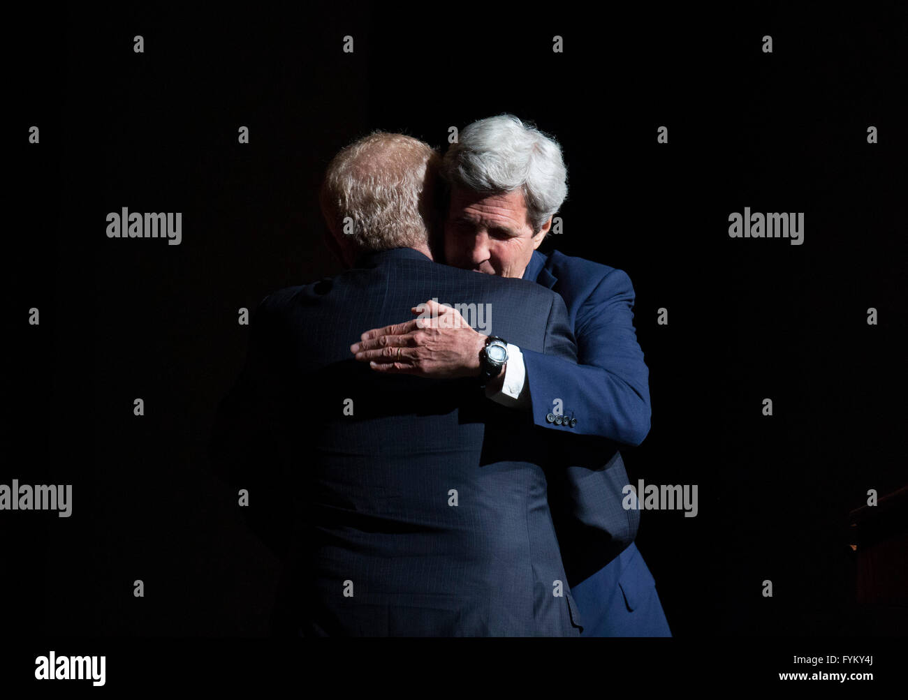 US Secretary of State John Kerry hugs Ben Barnes after talking about his Vietnam during a keynote at the Vietnam War Summit Stock Photo