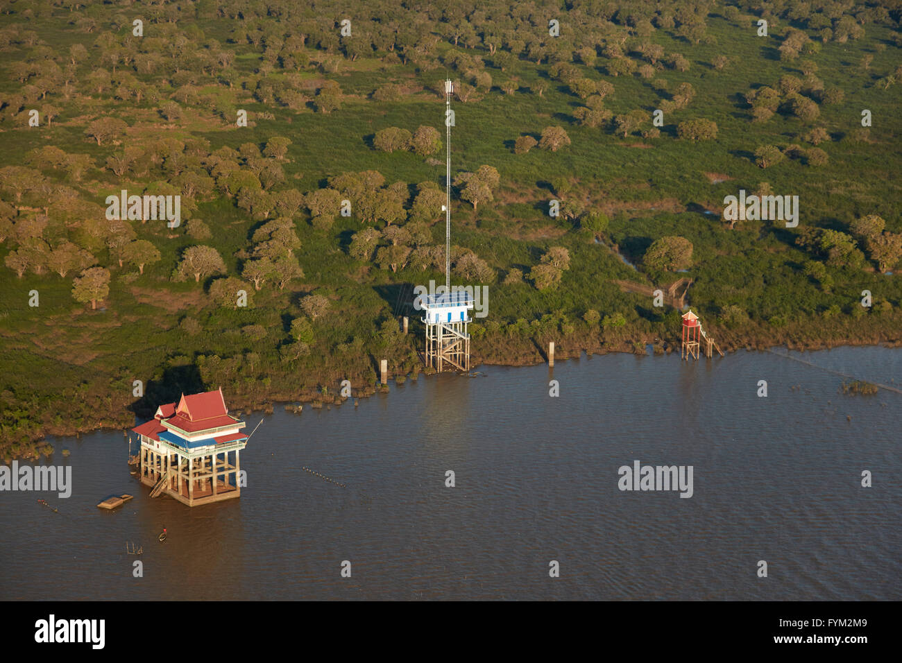 Temple on stilts and communications aerial, Tonlé Sap Lake, near Siem Reap, Cambodia - aerial Stock Photo