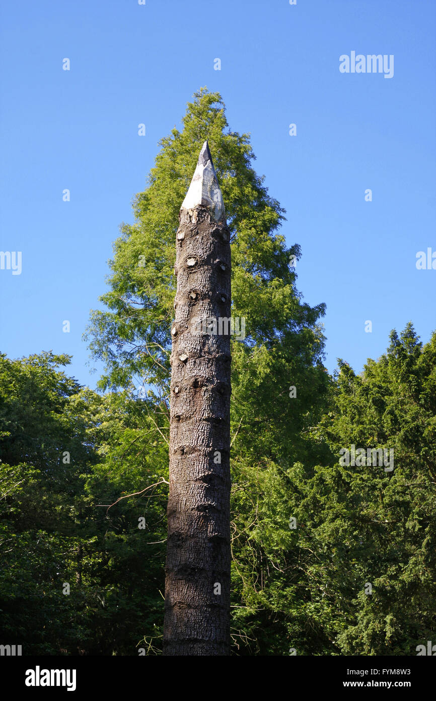 Tree trunk carved to look like a pencil Stock Photo