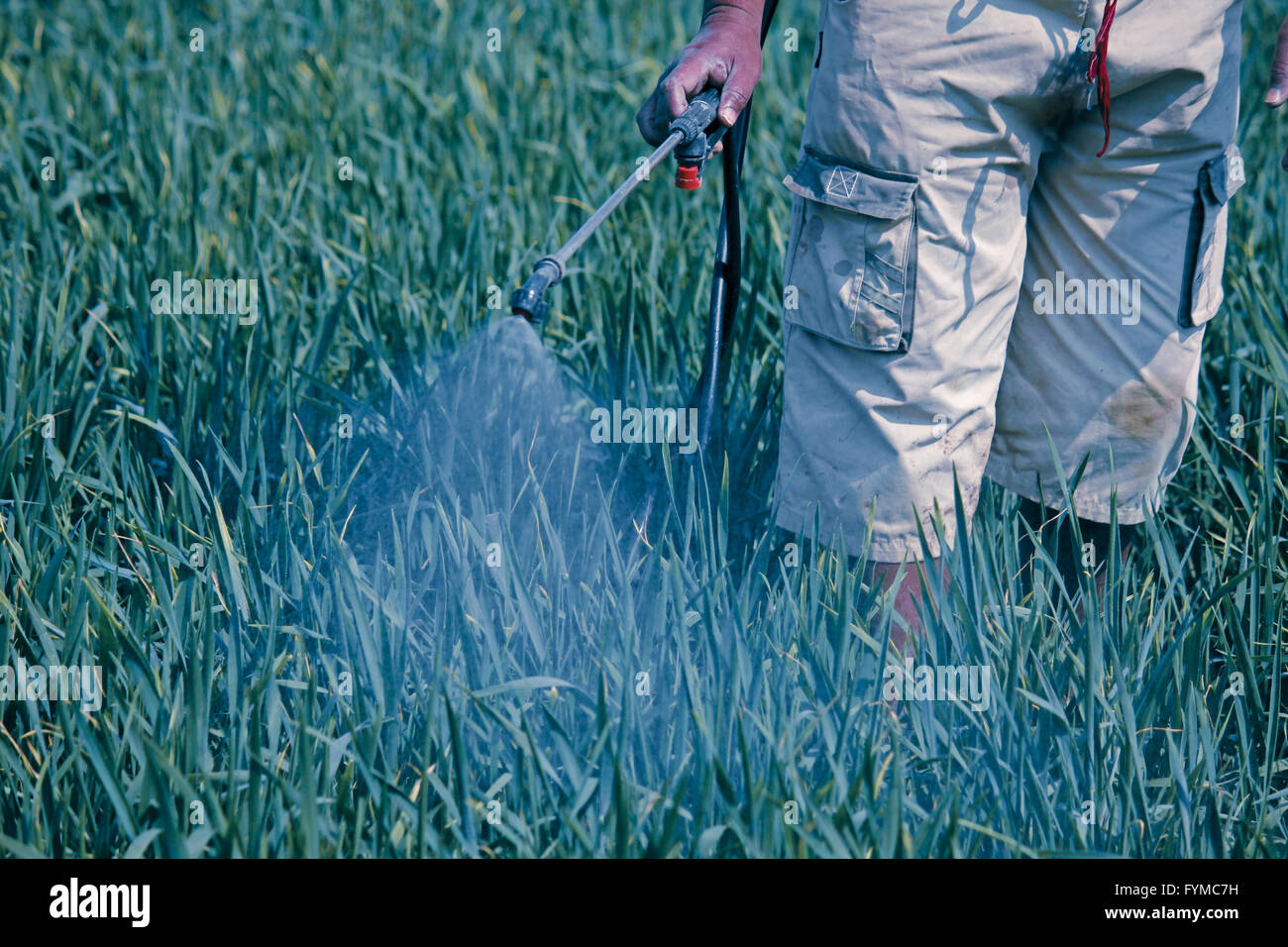 Agriculture farmer spraying fertilizer hires stock photography and images Alamy