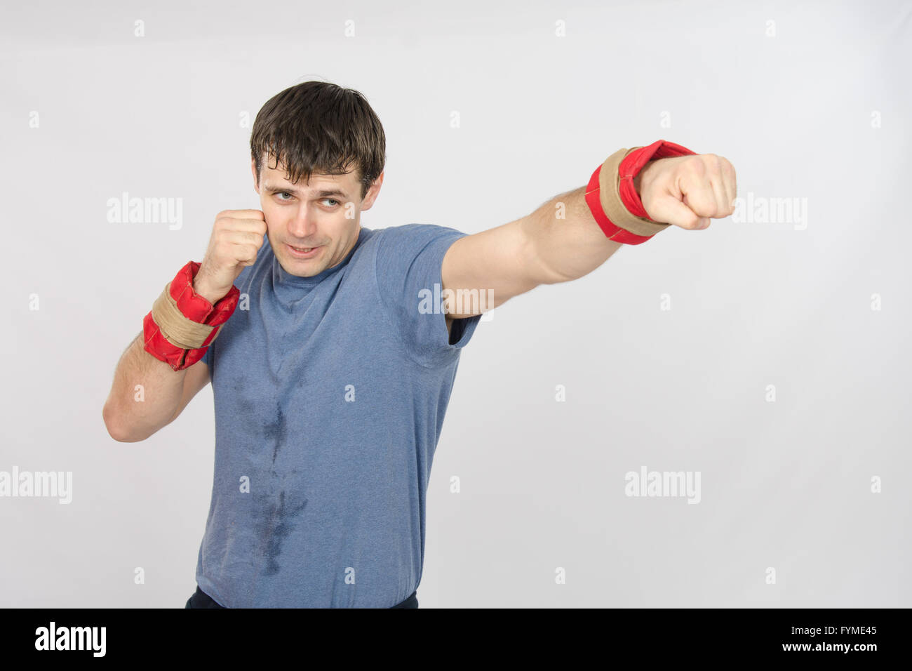 The athlete has his left hand with the weighting agent Stock Photo