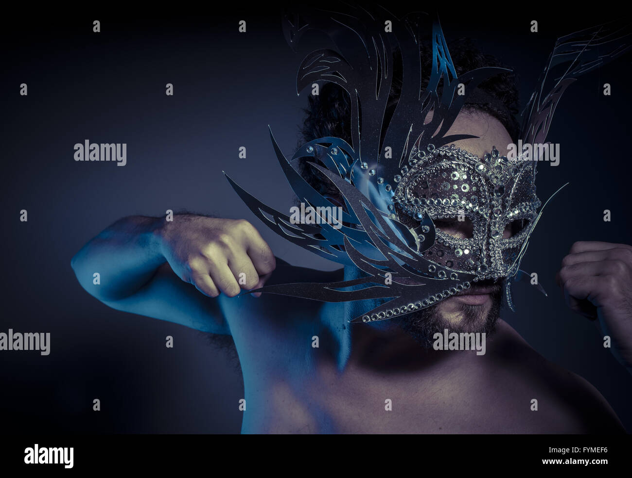 Carnival, bearded man with silver mask style. Mystery and