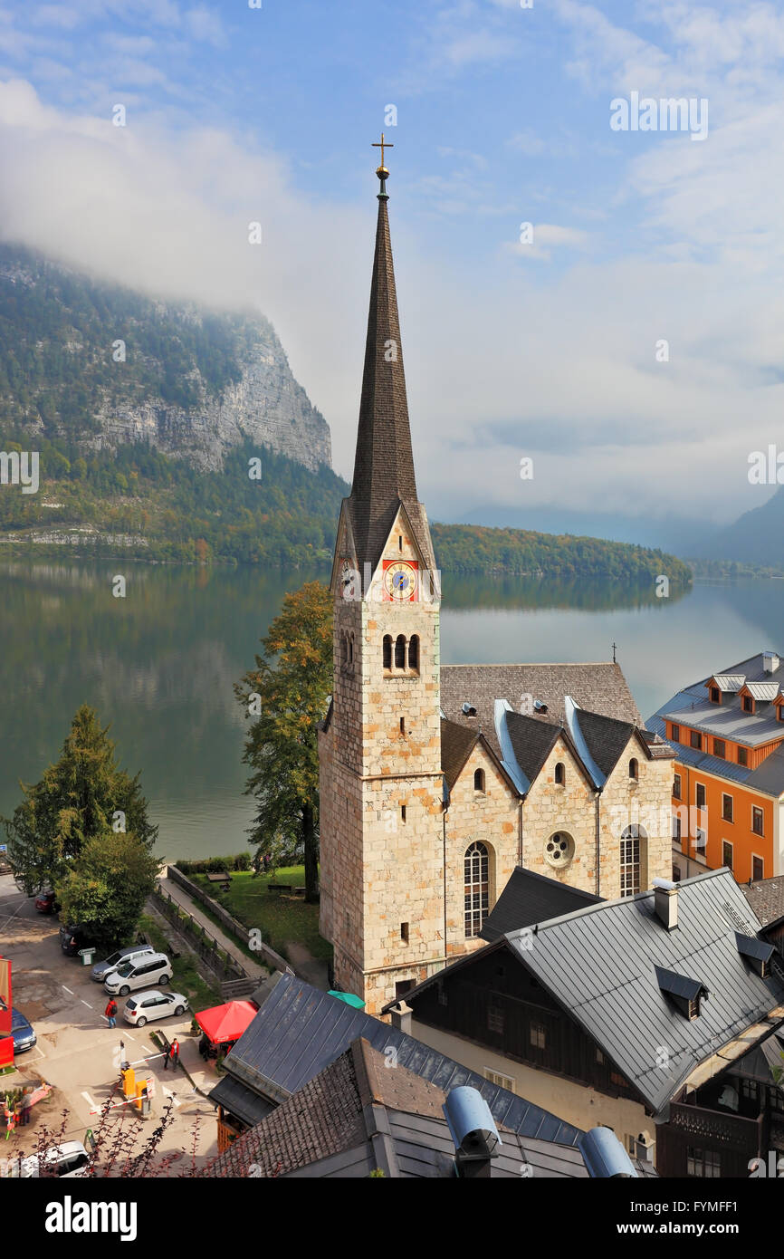 The belfry and Lutheran church on the shore of lake Stock Photo