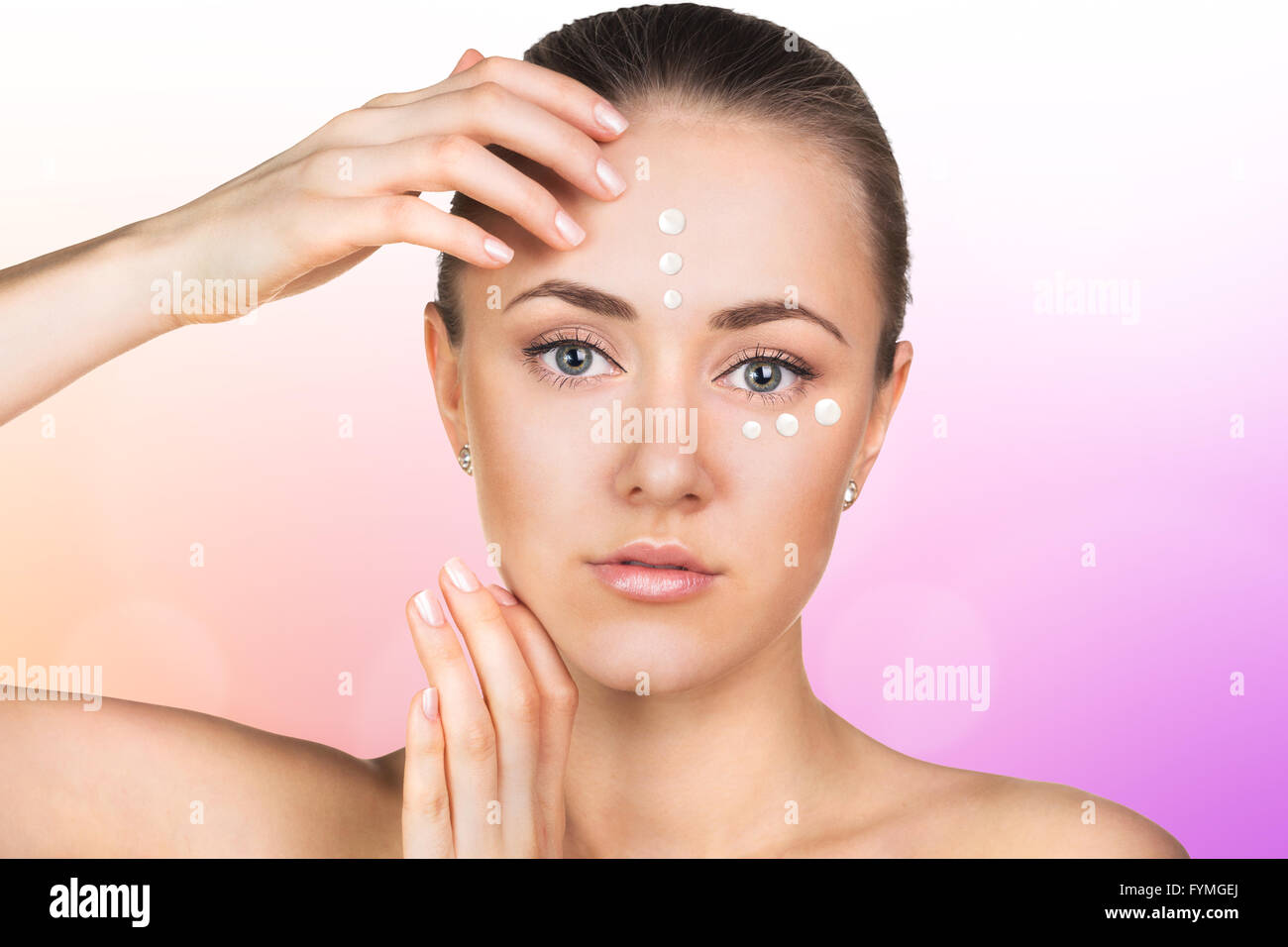 Girl with cream dots on face Stock Photo Alamy