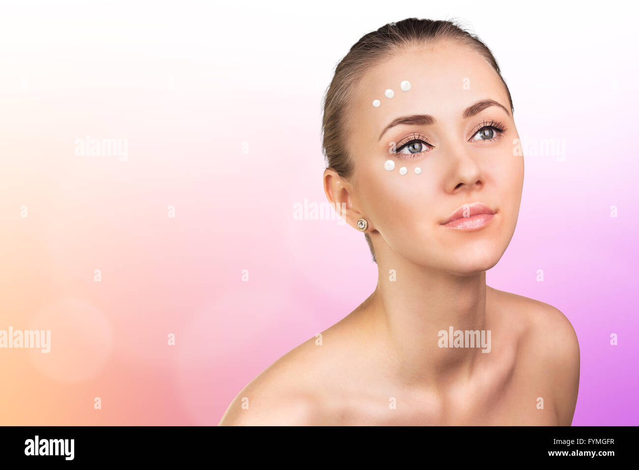 Girl with cream dots on face Stock Photo Alamy