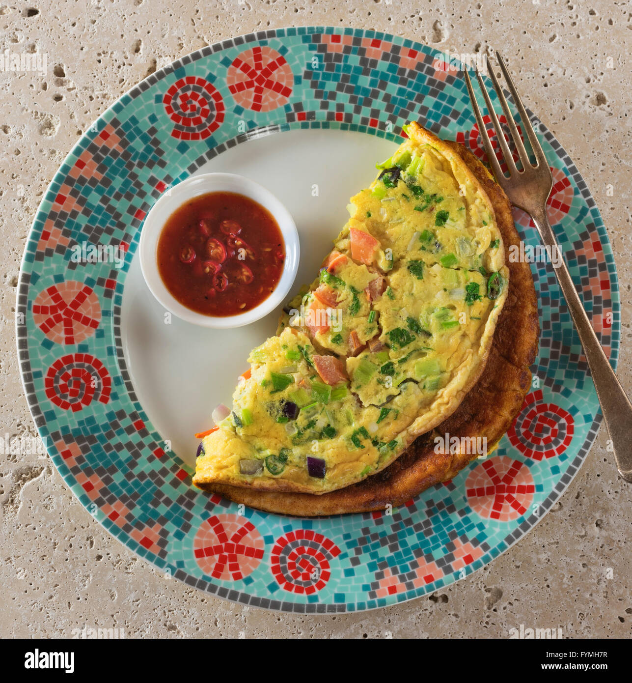 Masala omelette. Spicy Indian omelet with chilli ketchup and chapatis