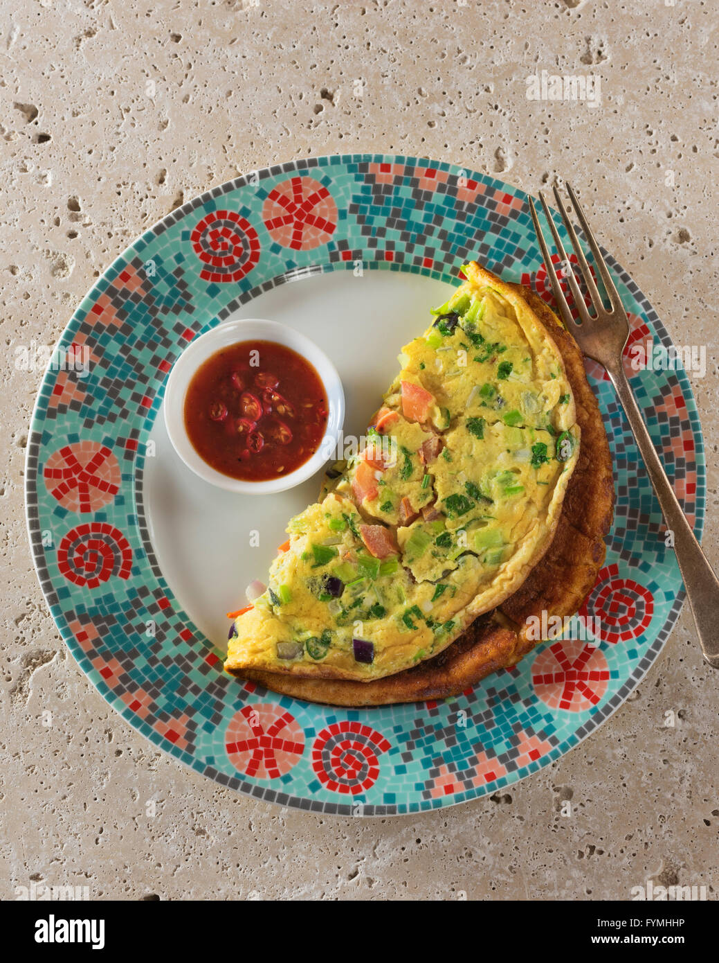 Masala omelette. Spicy Indian omelet with chilli ketchup and chapatis