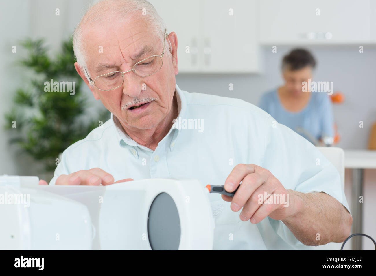 fixing a coffee maker machine Stock Photo Alamy
