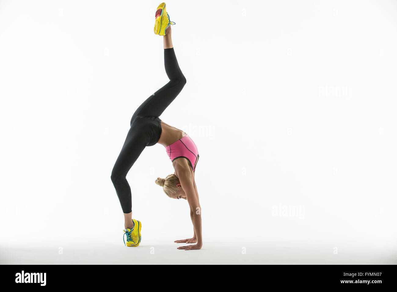 Rhythmic gymnast doing exercise in studio Stock Photo Alamy
