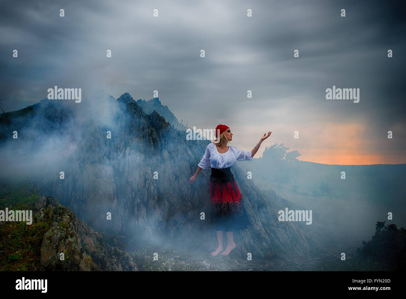 Artistic portrait of a girl surrounded by smoke Stock Photo