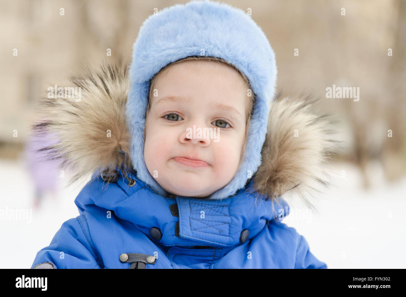 Portrait of a three-year girl in the winter Stock Photo