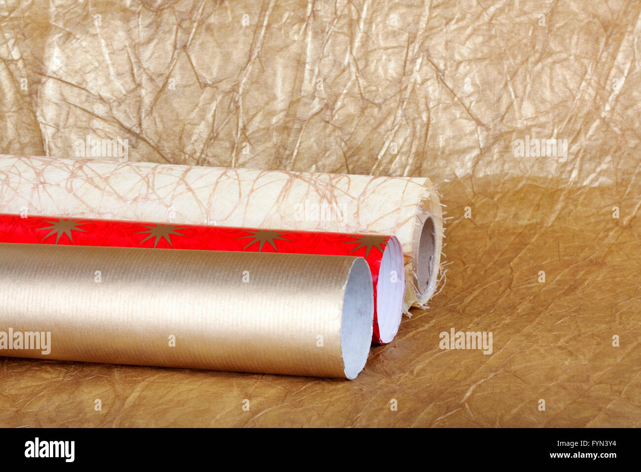 Rolls of multicolored wrapping paper for gifts background Stock Photo ...