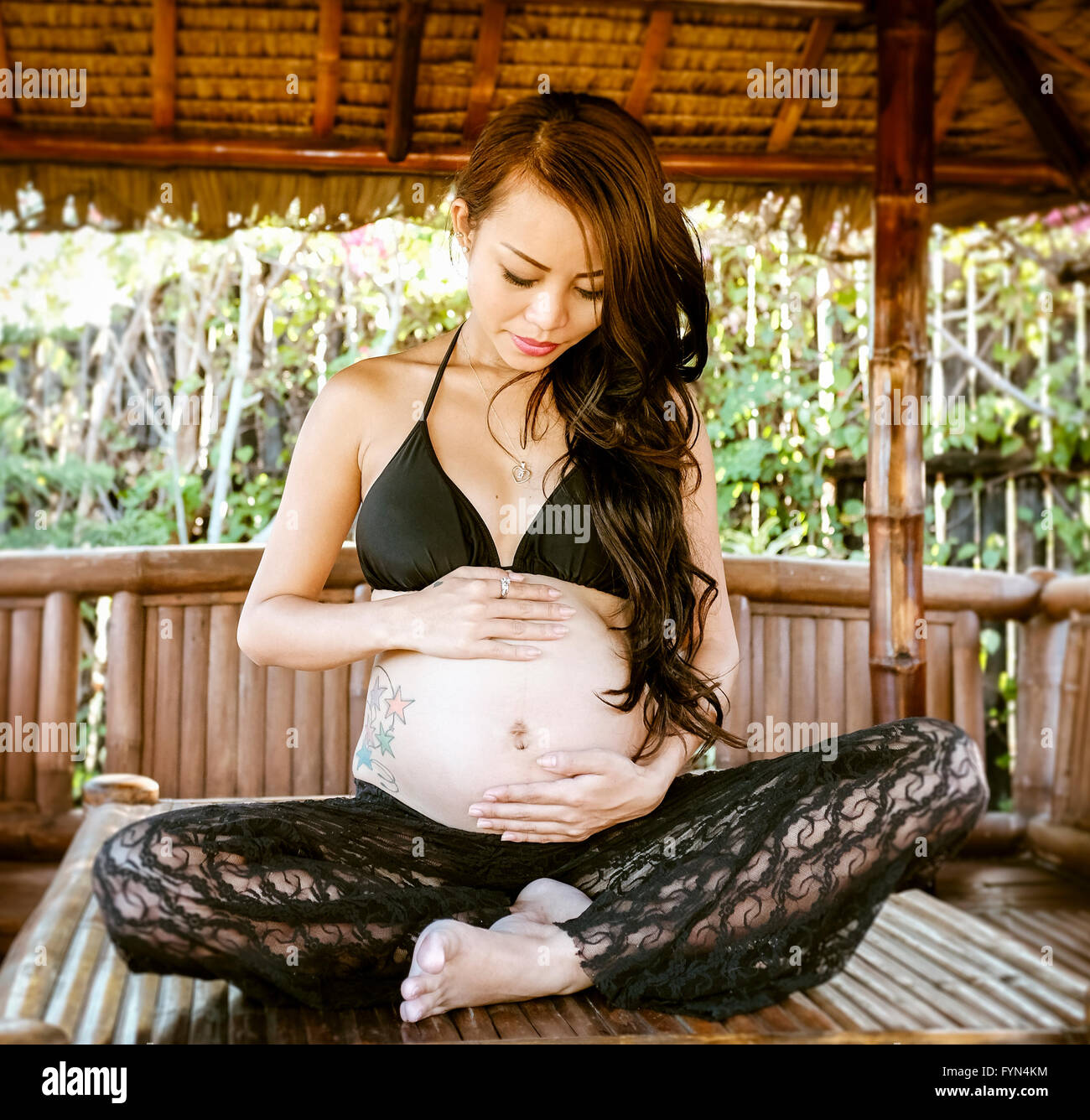 Beautiful pregnant Asian woman Stock Photo