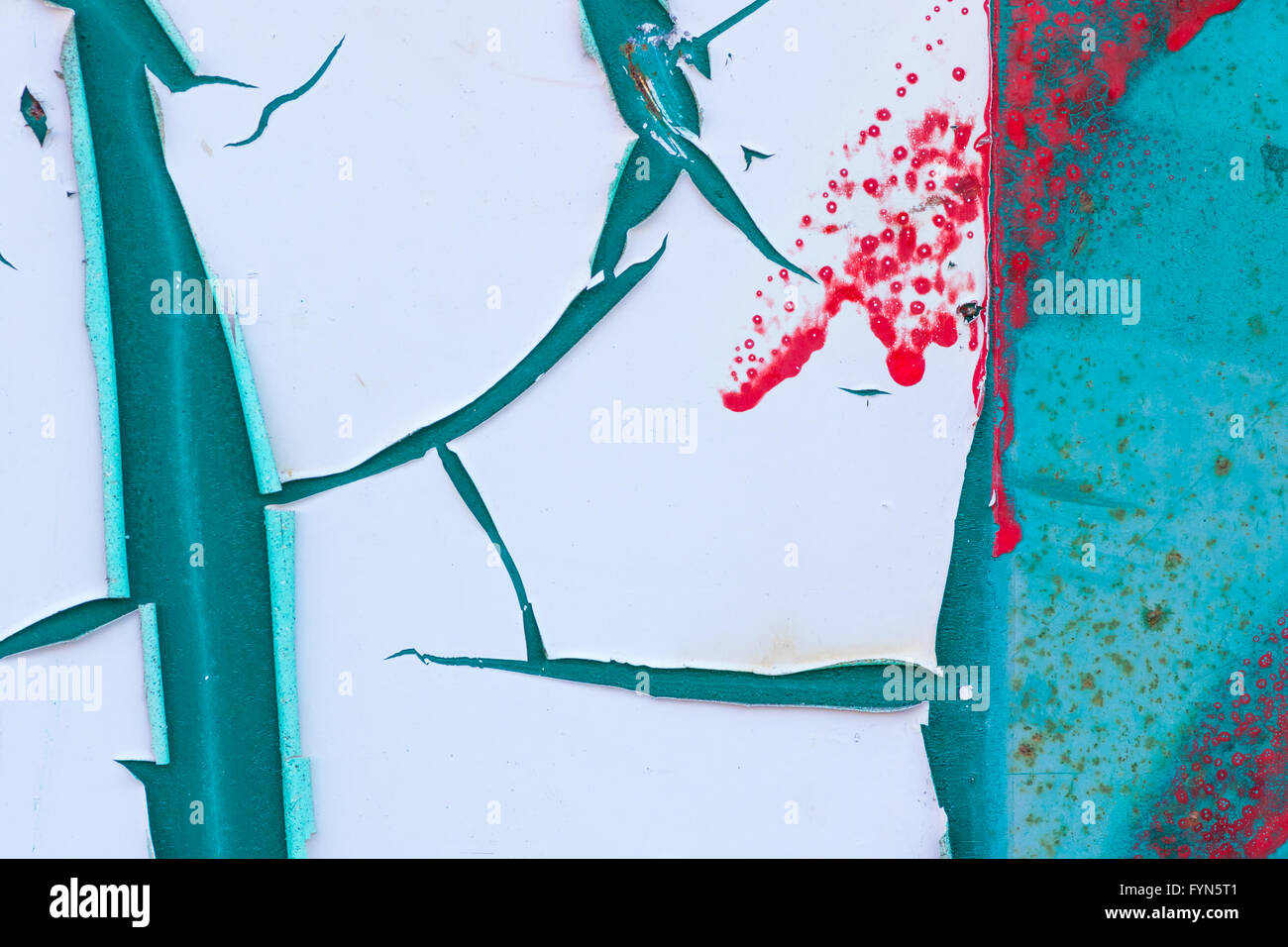 Abstract of peeling white paint on a turquoise background with red splatters and rust  marks. Stock Photo