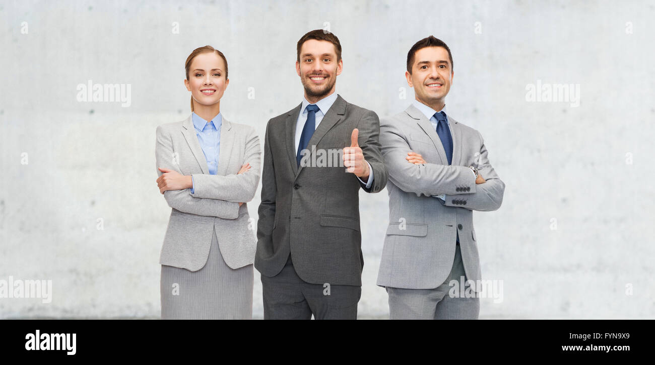 happy business team showing thumbs up Stock Photo - Alamy