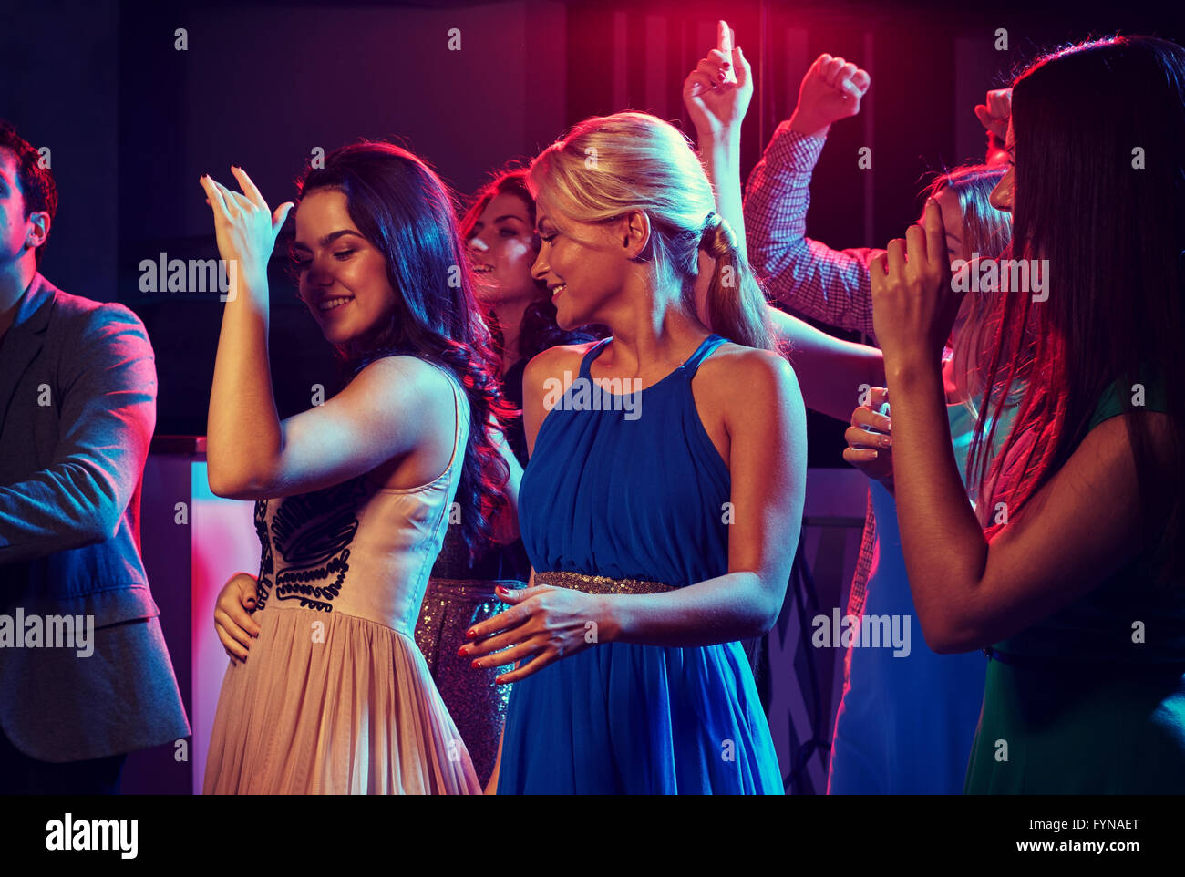 group of happy friends dancing in night club Stock Photo - Alamy