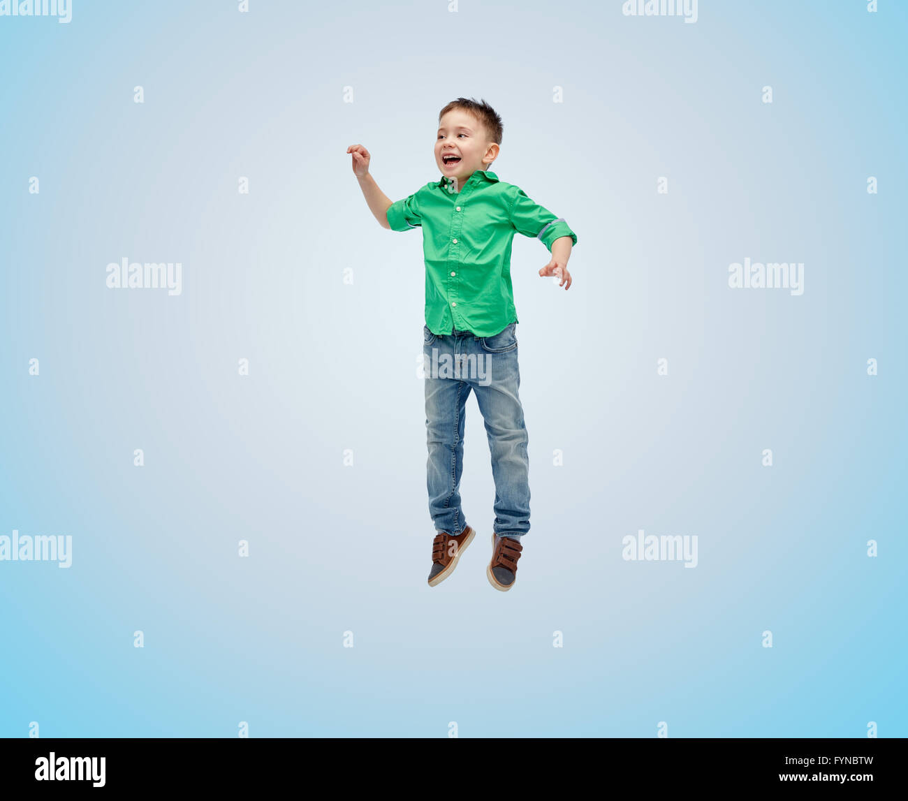 happy little boy jumping in air Stock Photo - Alamy