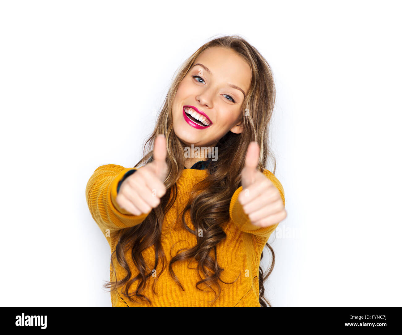 happy young woman or teen girl showing thumbs up Stock Photo - Alamy