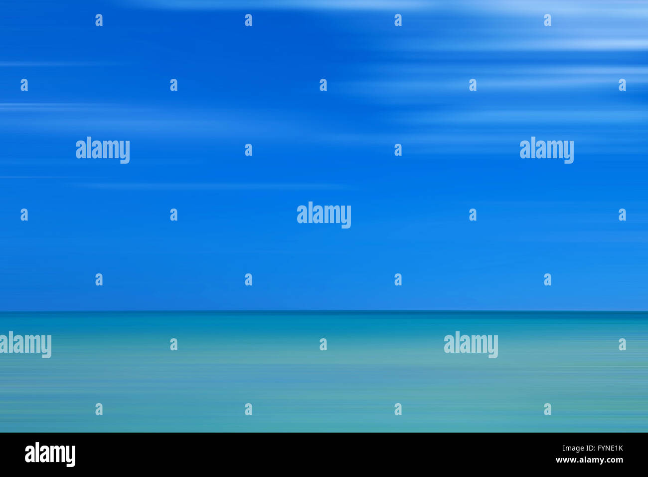 Blurred sea horizon. One third of the image is green, two-thirds of the image are blue as a sky. Stock Photo