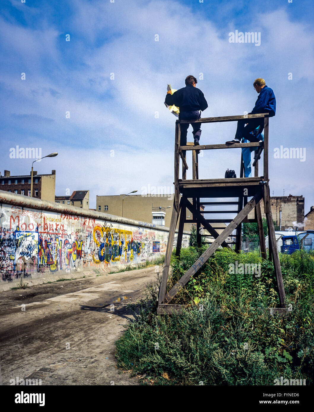 August 1986, Berlin Wall graffitis, people on observation platform looking over the Wall, Zimmerstrasse street, West Berlin side, Germany, Europe, Stock Photo