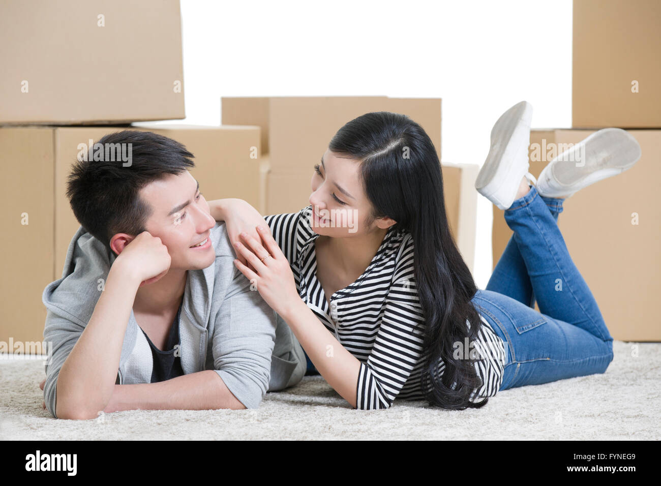 Young couple moving to a new house Stock Photo - Alamy