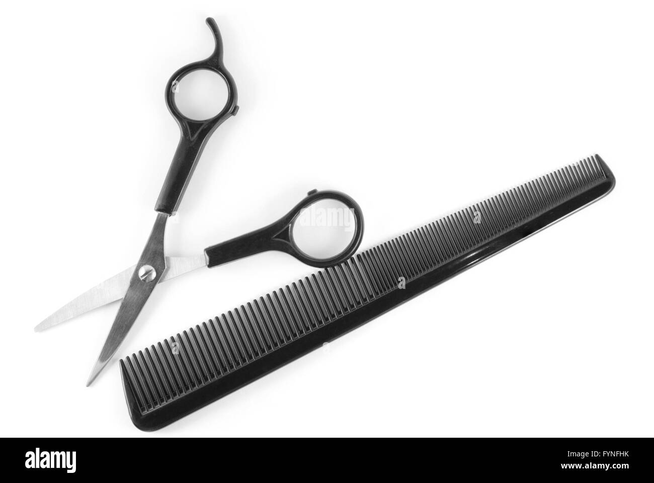 scissors and comb isolated on white Stock Photo Alamy