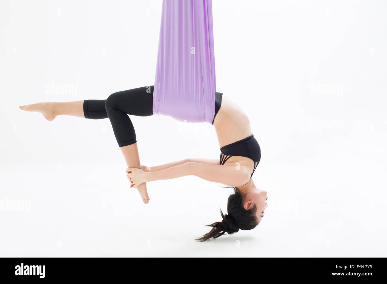 Women yoga bending over hi-res stock photography and images - Alamy