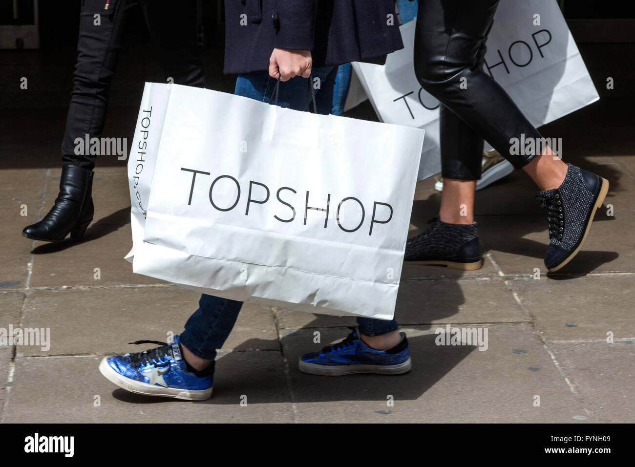 Shopper on London's Oxford Street carrying a Topshop shopping bag Stock ...
