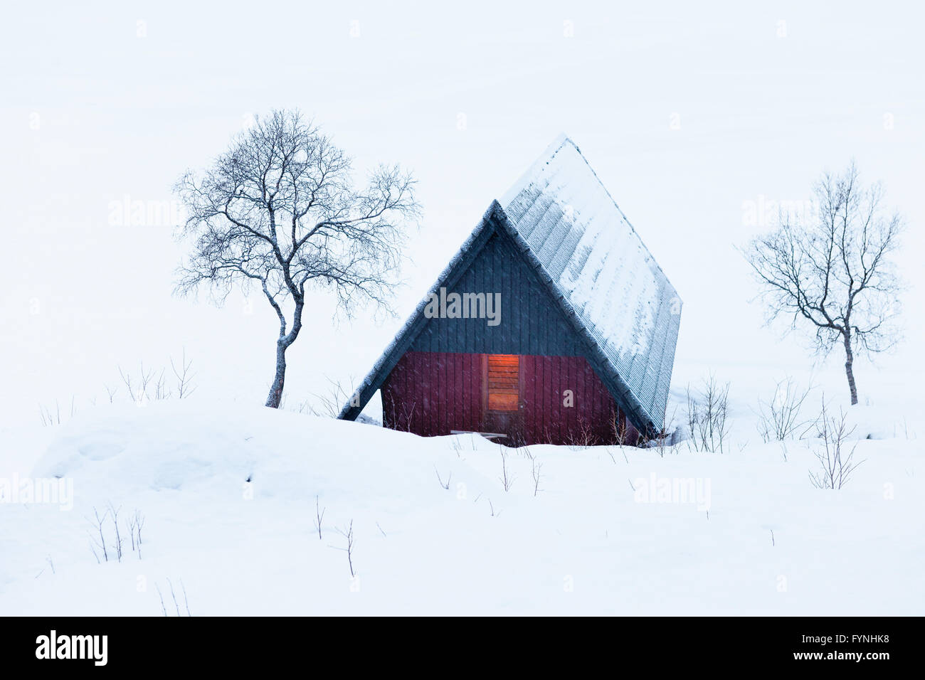 Wooden Shack in Snow by a Frozen Lake in Arctic Norway Stock Photo - Alamy