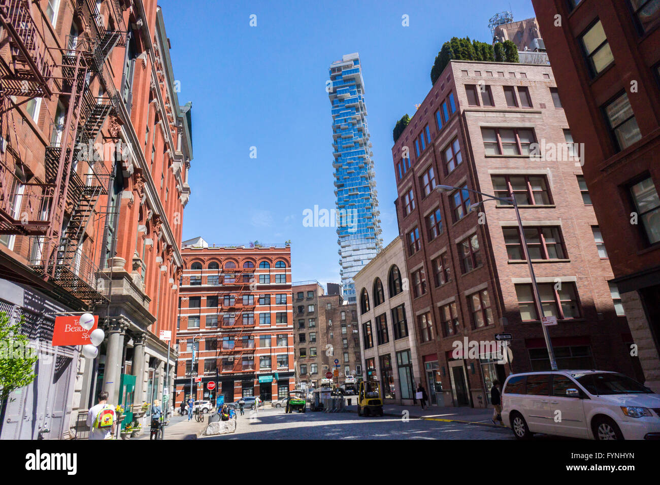 The condo skyscraper at 56 Leonard Street looms over older buildings in Tribeca in New York on Saturday, April 23, 2016. Designed by Herzog & de Meuron the condo is 820 feet high with 145 apartments, many already in contract. (© Richard B. Levine) Stock Photo
