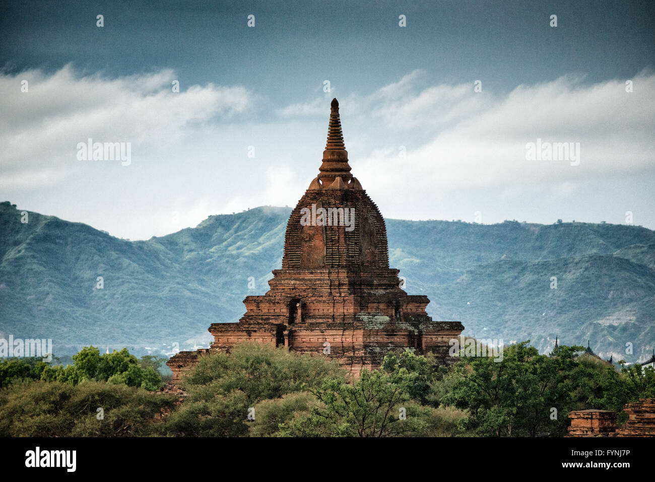 BAGAN, Myanmar - One of the thousands of pagodas and stupa on the plan of Bagan in Myanmar (Burma). This one is in the northwest corner of the Bagan Archeological Zone and are seen from Shegy Gyi Phaya. Stock Photo