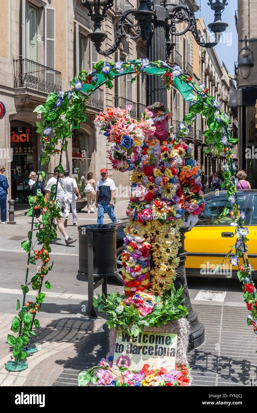 Human Statue with flowers, La Rambla, Ramblas, Barcelona Stock Photo