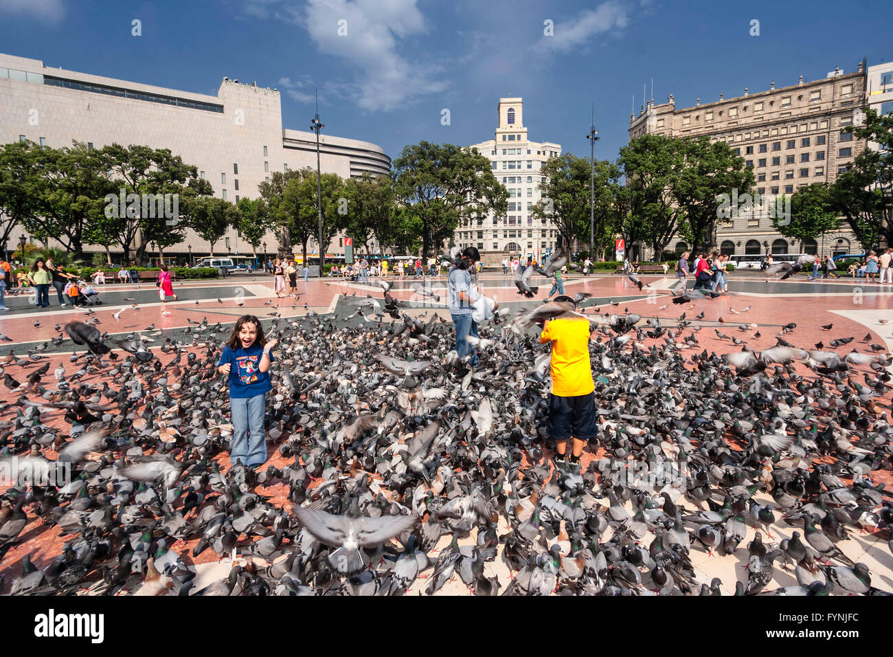 Plaza De Catalunya, Tourists with doves, Barcelona, Spain Stock Photo