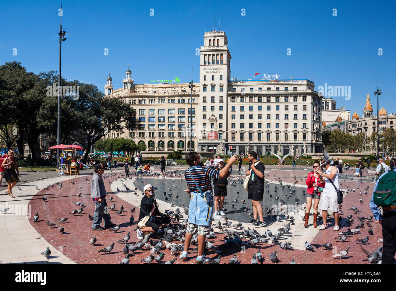 Plaza De Catalunya, Tourists with doves, Barcelona, Spain Stock Photo