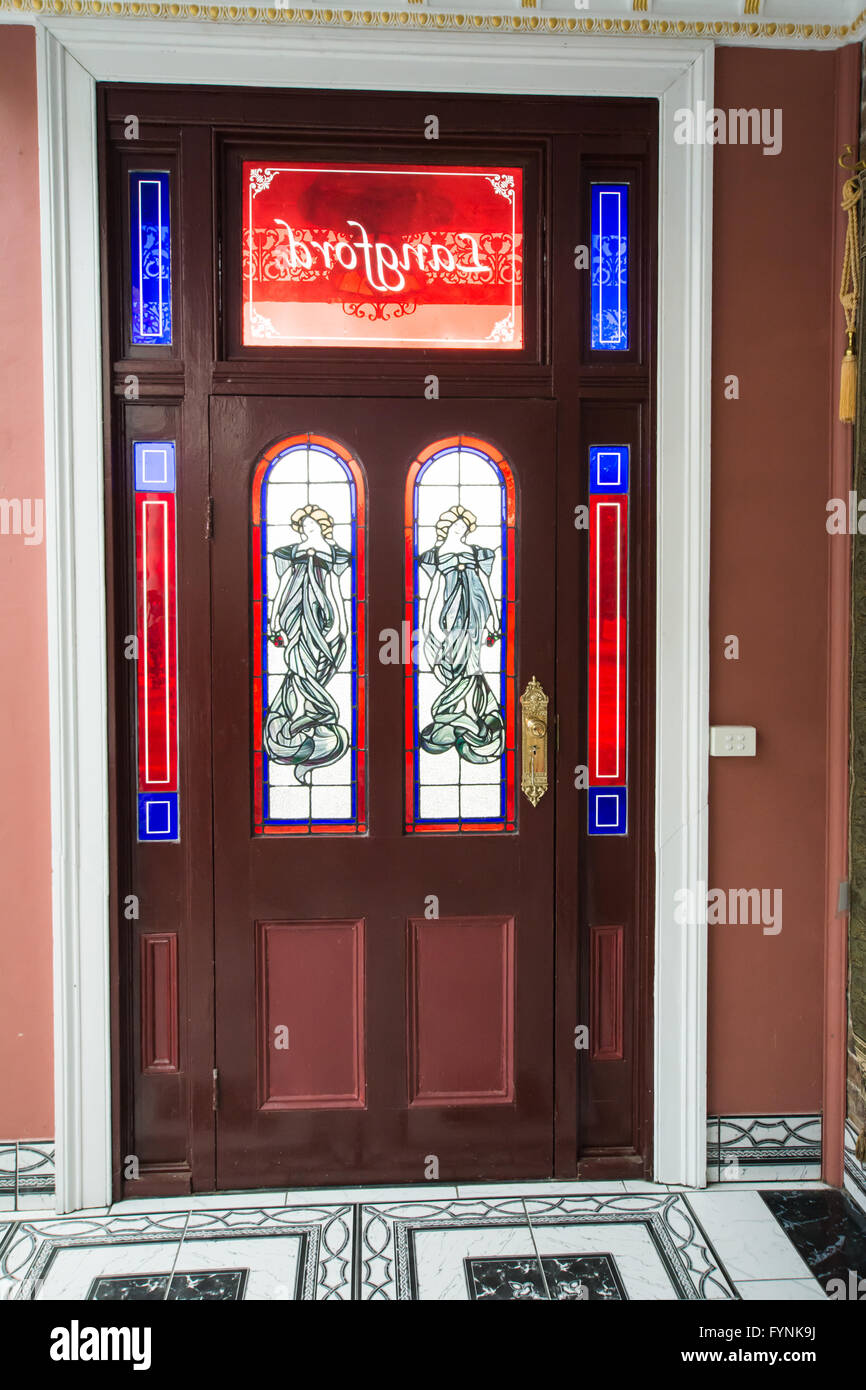 Side entry door with stained glass decoration Langford Homestead Walcha Australia Stock Photo