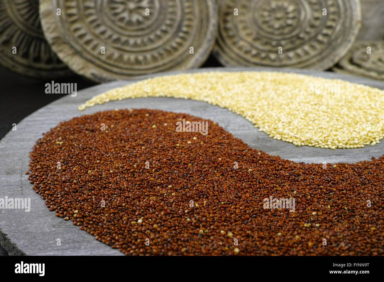 Black and white quinoa grain on wooden plate Stock Photo - Alamy