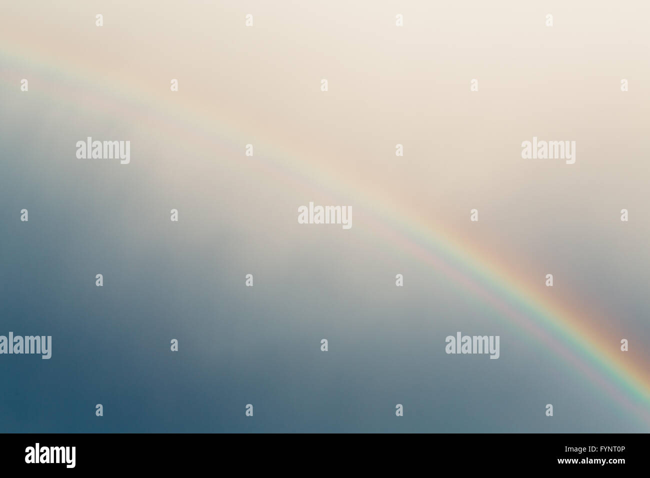 Blue sky and rainbow photo Stock Photo - Alamy