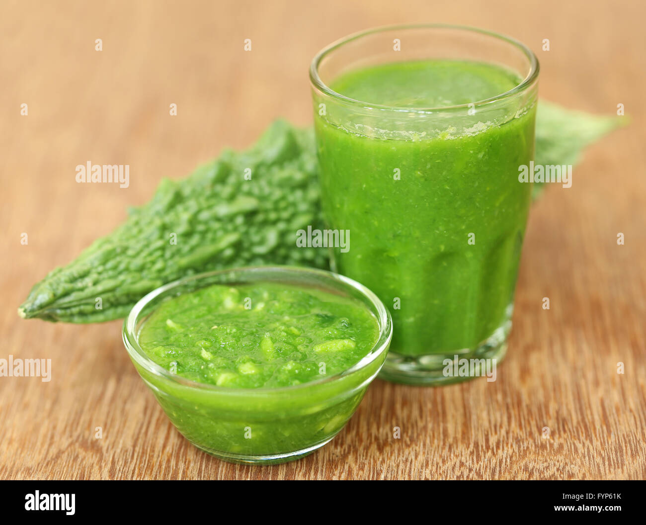 Herbal juice of green momodica with green vegetable Stock Photo