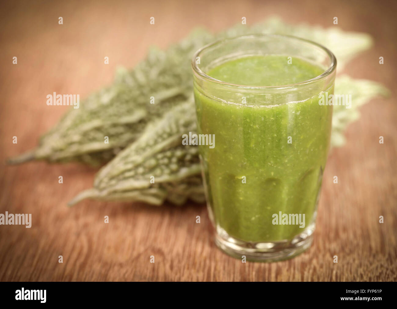 Herbal juice of green momodica with green vegetable Stock Photo