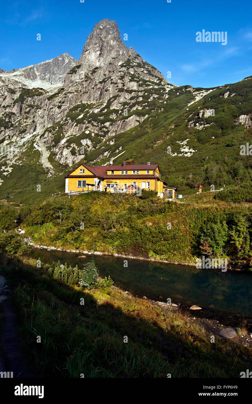 Chata pri Zelenom plese chalet with Jastrabia veza and Kolovy stit peaks in summer High Tatras mountains with clear sky Stock Photo