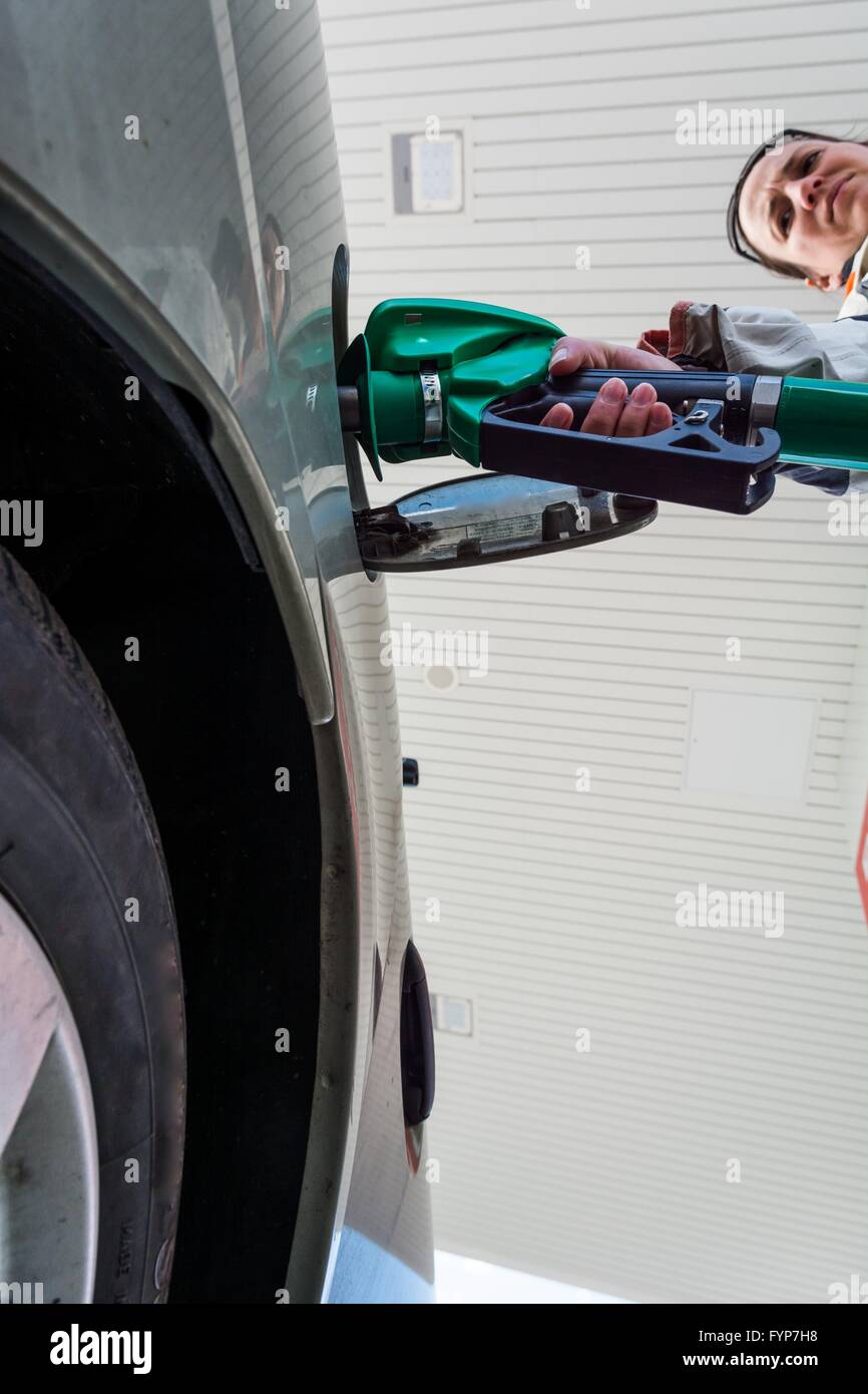 Pumping gas. Hand holding fuel nozzle Stock Photo Alamy