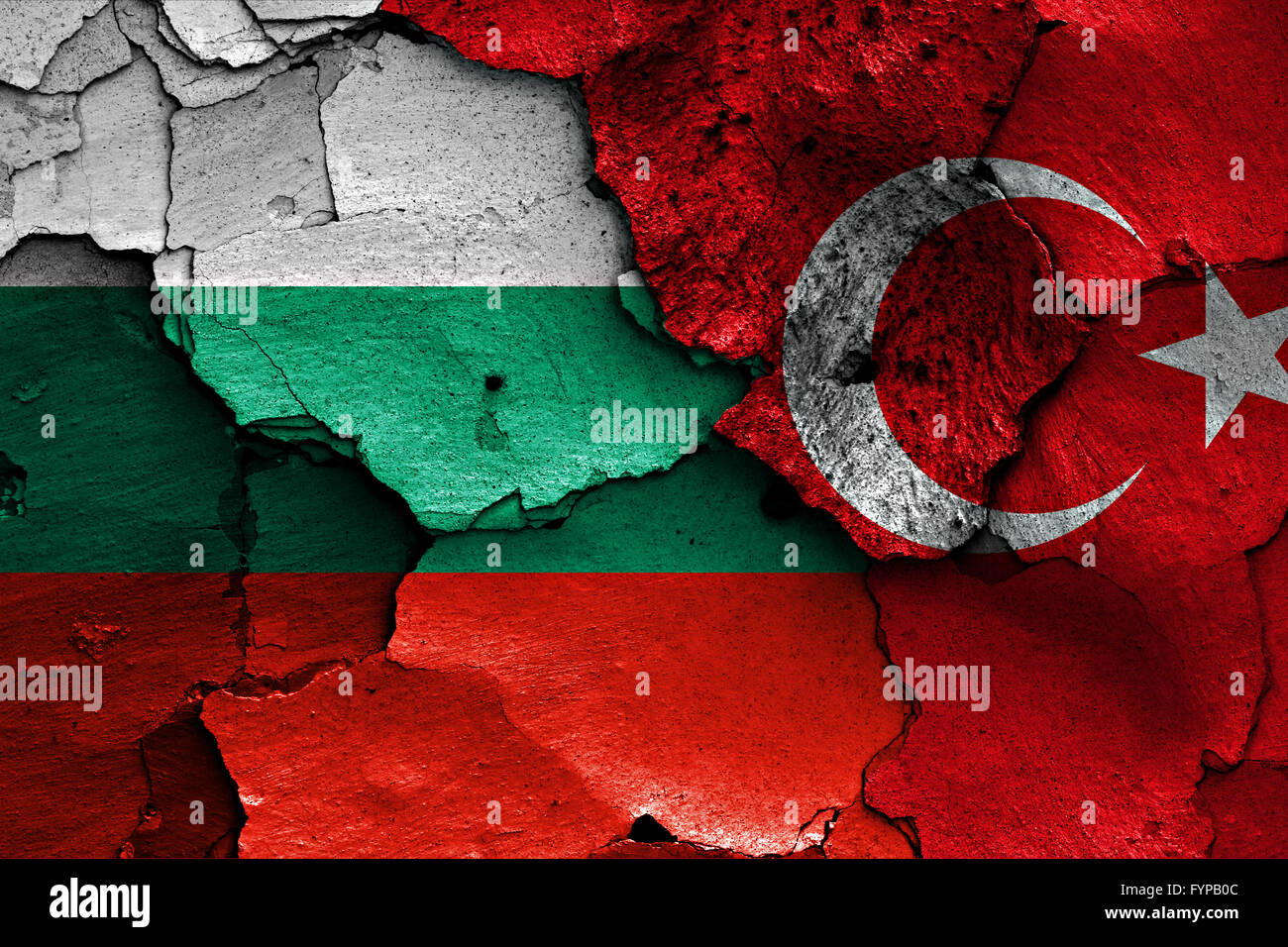 flags of Bulgaria and Turkey painted on cracked wa Stock Photo