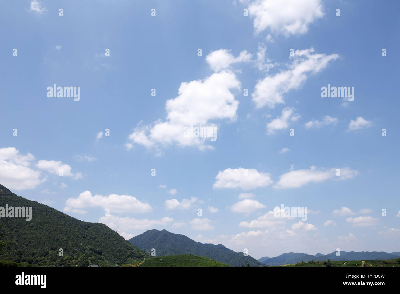 mountains under clear, blue sky and white cloud Stock Photo - Alamy