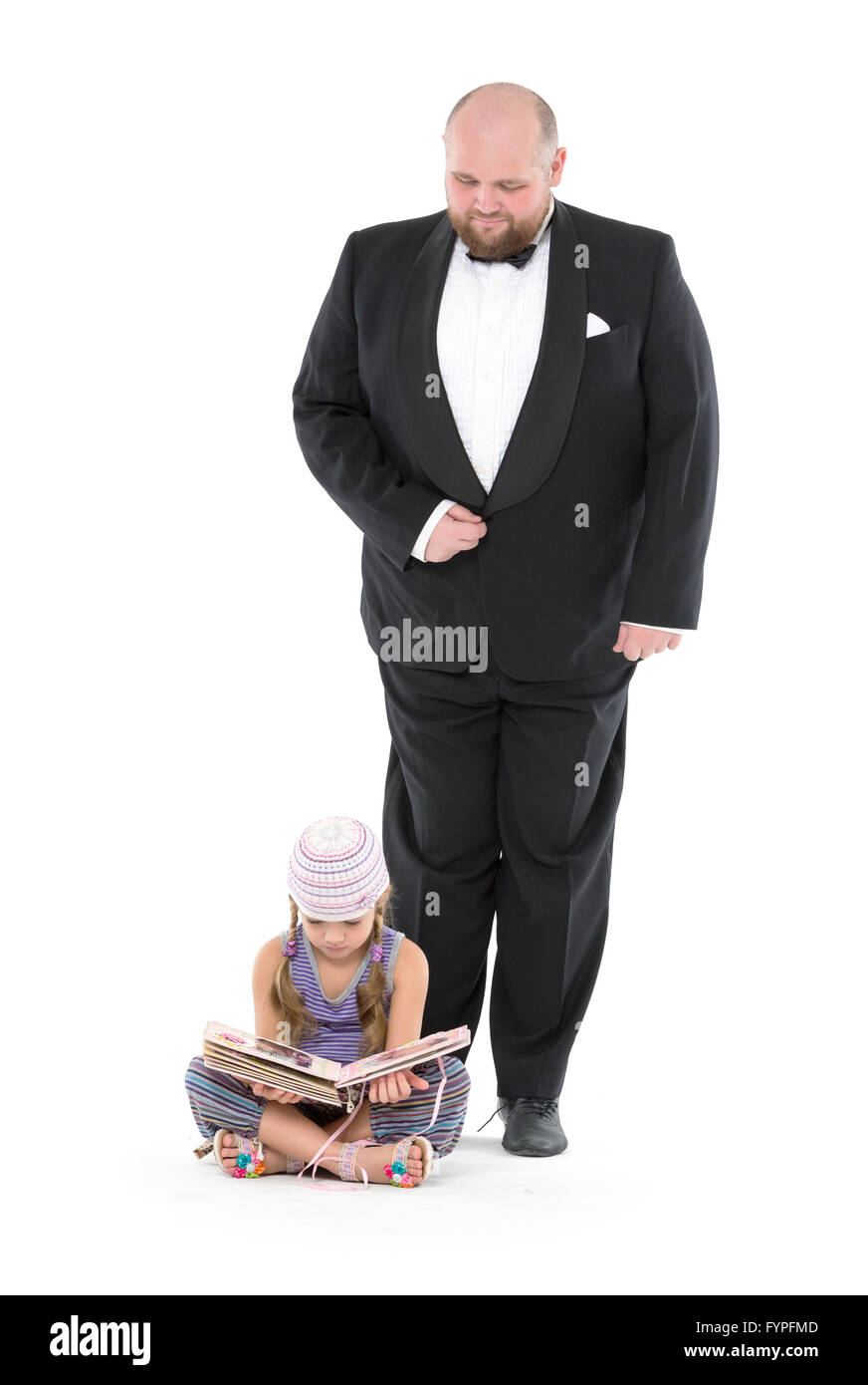 Little Girl and Servant in Tuxedo Stock Photo