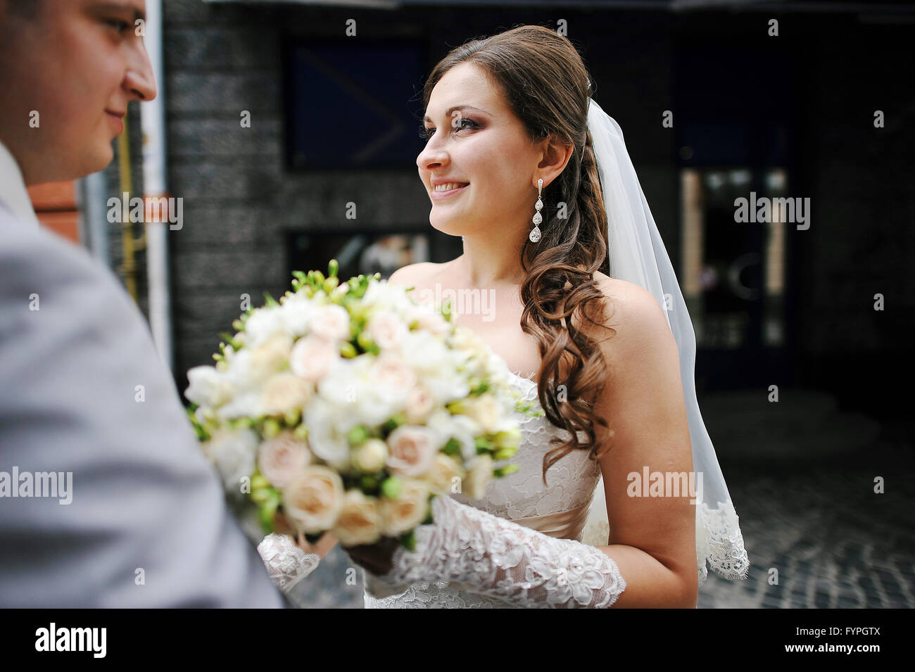 Wedding bouquet at hands of bride Stock Photo