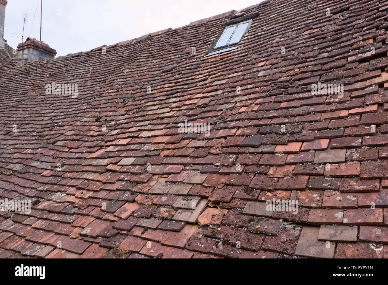 View over an old french worn out clay shingle roof, with a an iron Stock Photo 103151713 Alamy