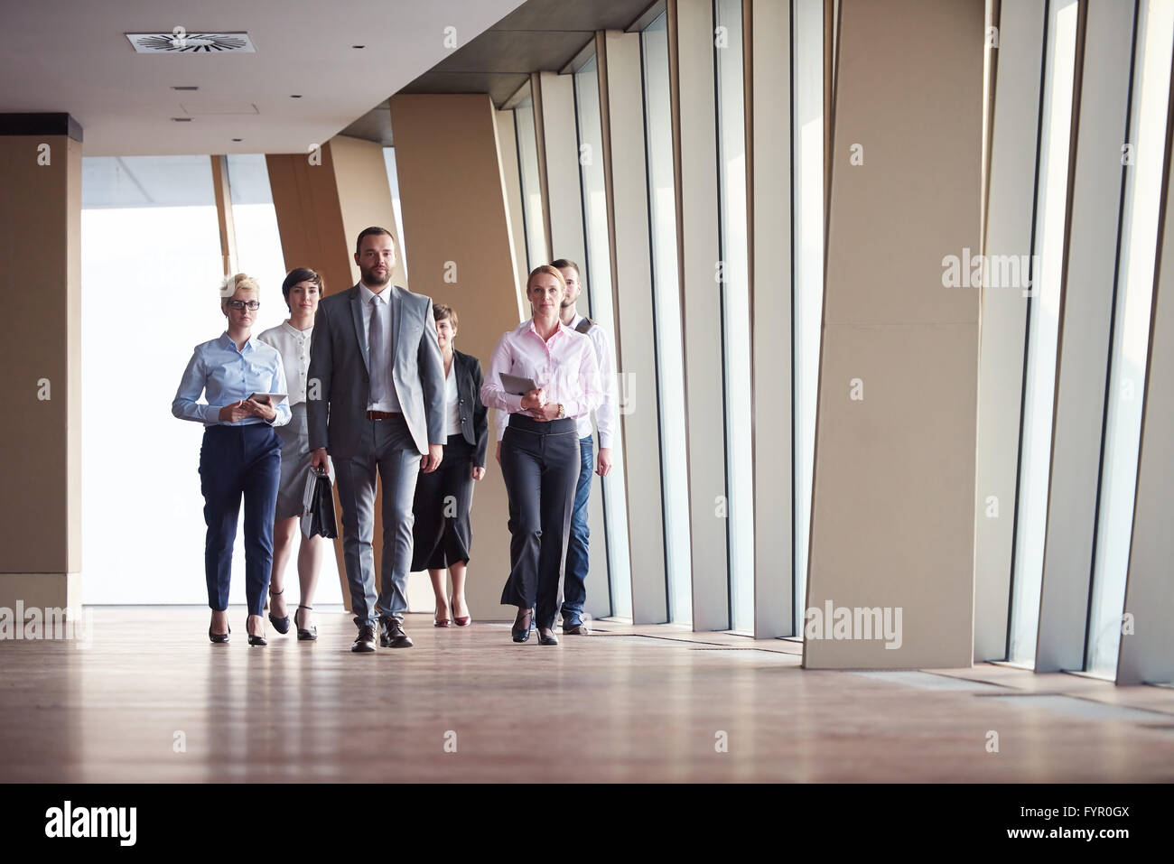 business people group walking Stock Photo - Alamy