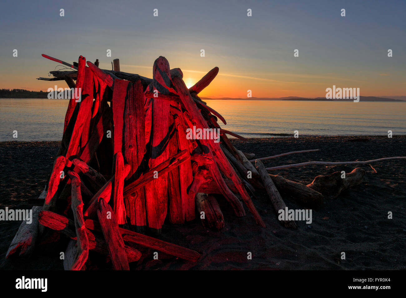 Lean to shelter on Island View beach at sunrise-Victoria, British Columbia, Canada. Stock Photo